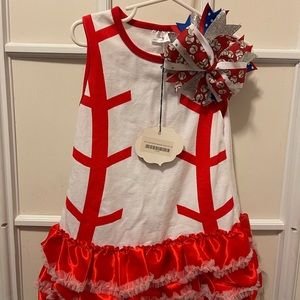 Lil girl’s baseball dress with matching bow.
